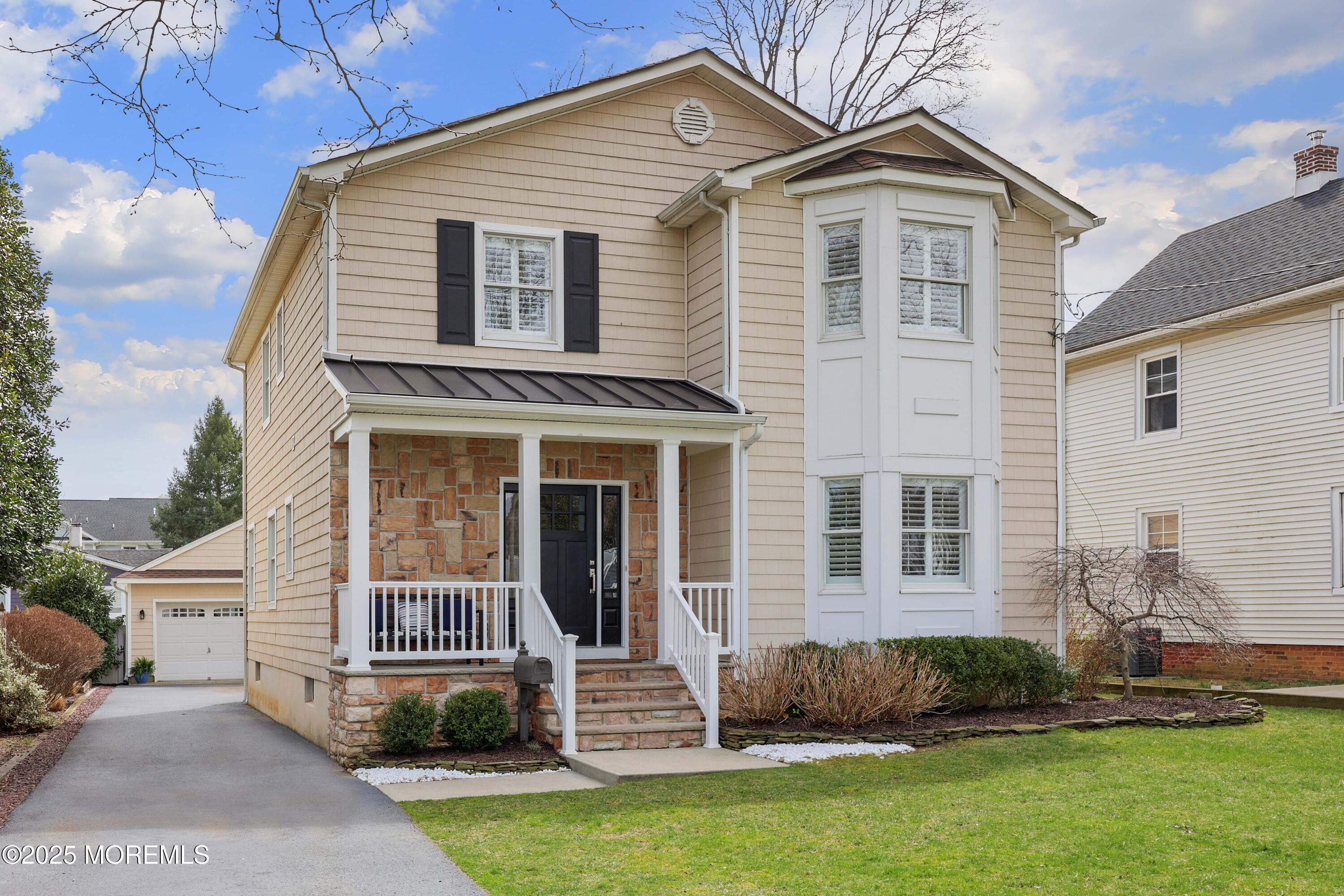 105 Black Point Road Rumson, NJ 07760 - Photo 2 of 27 a front view of a house with a yard