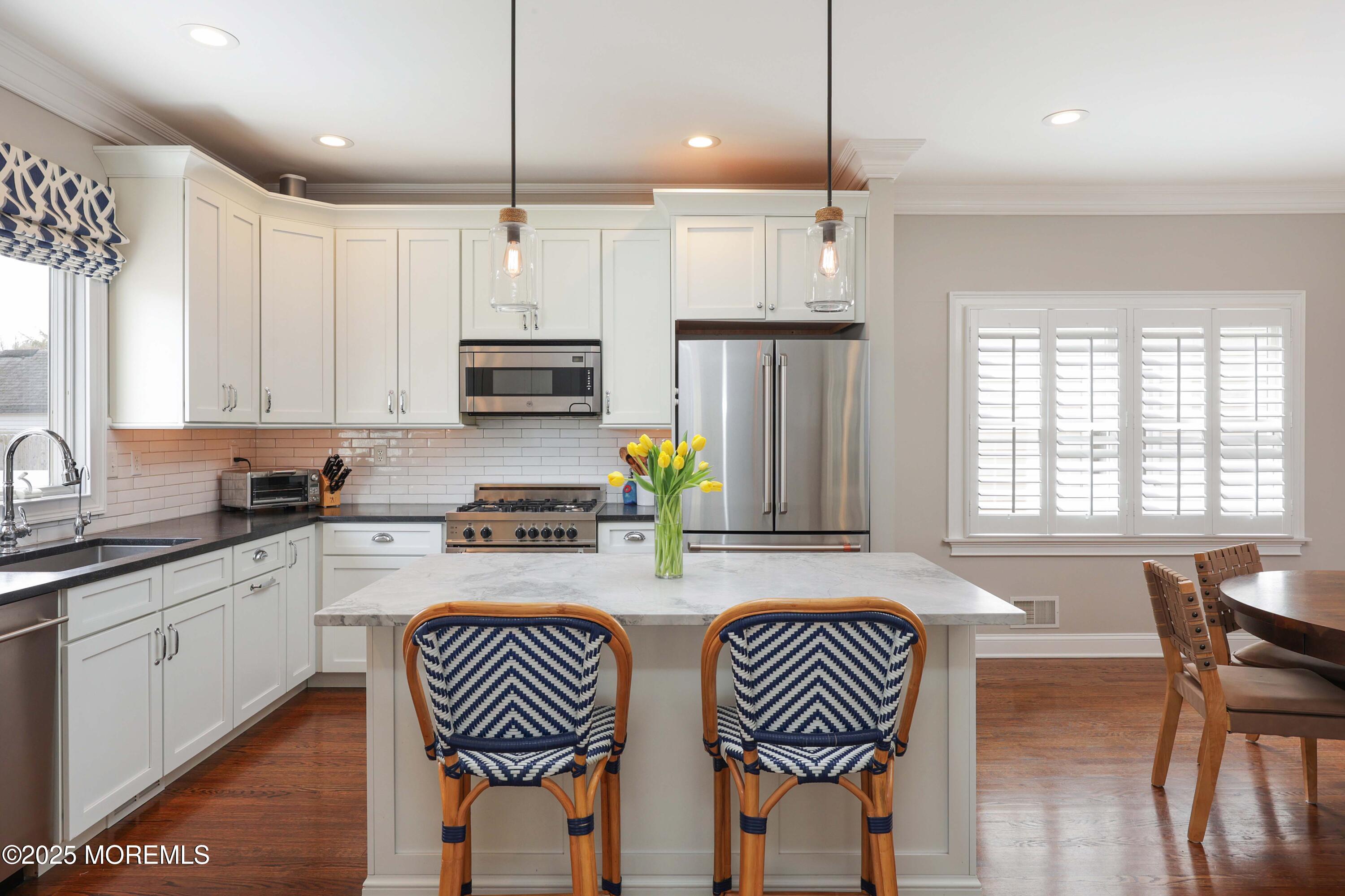 105 Black Point Road Rumson, NJ 07760 - Photo 3 of 27 a kitchen with stainless steel appliances granite countertop a stove a sink and a refrigerator