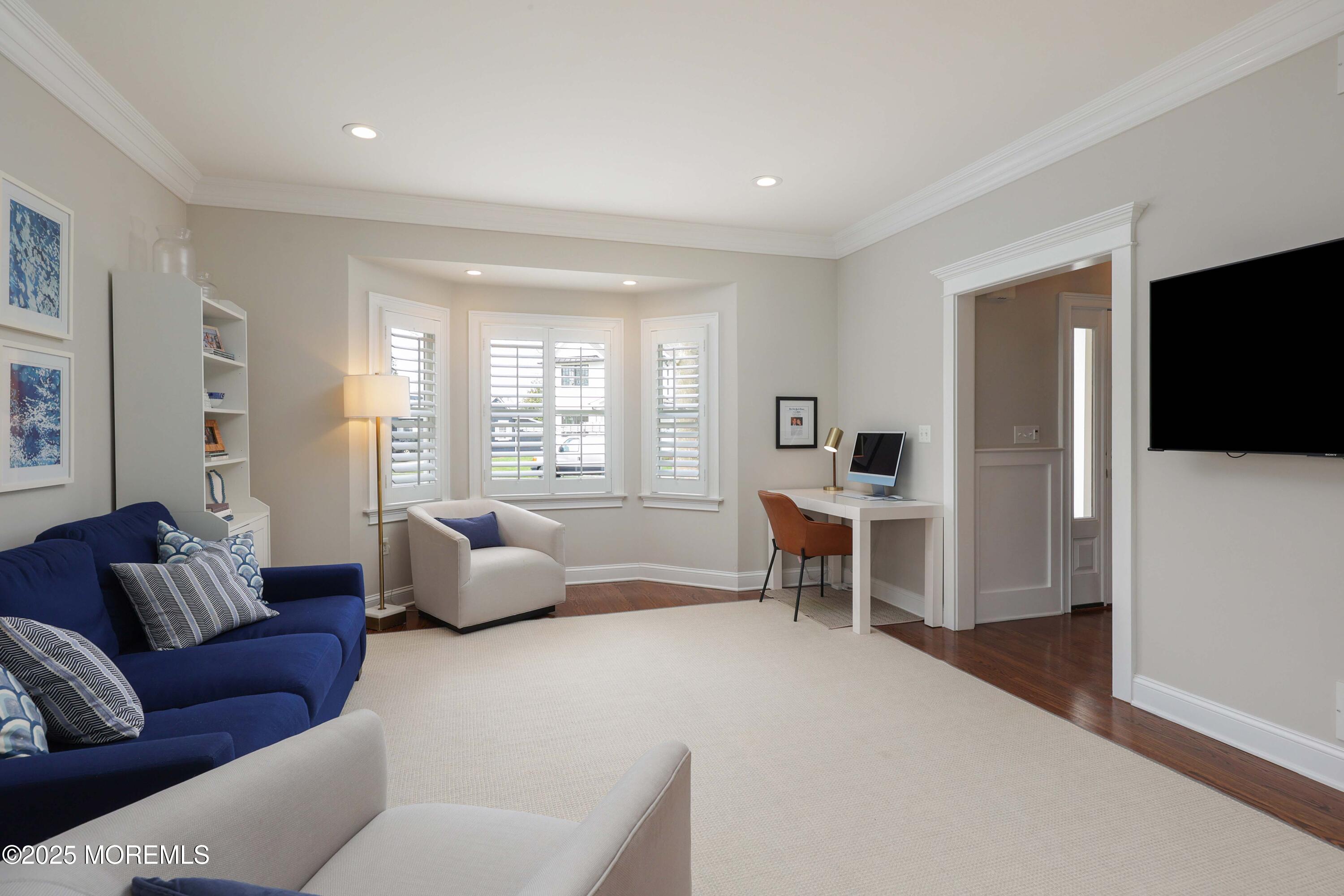 105 Black Point Road Rumson, NJ 07760 - Photo 6 of 27 a living room with furniture and a flat screen tv