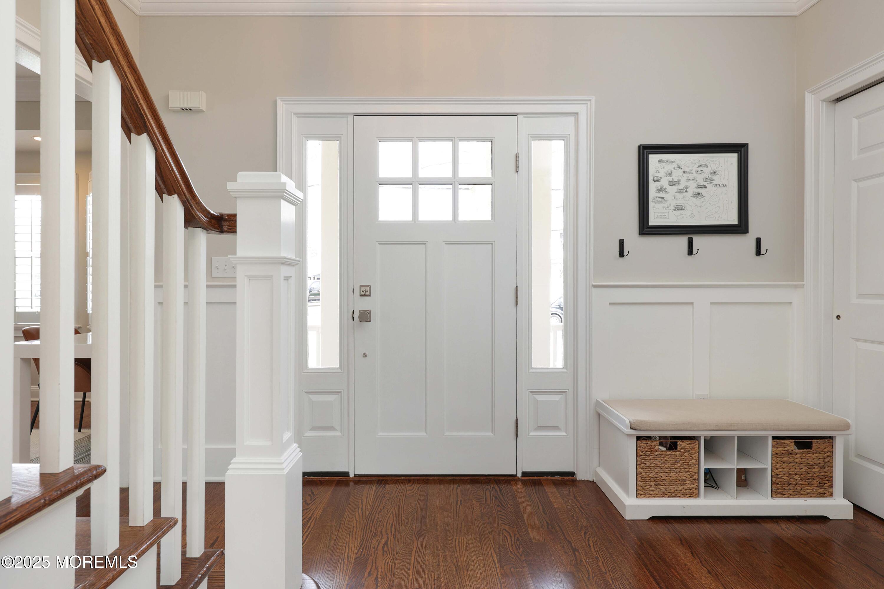 105 Black Point Road Rumson, NJ 07760 - Photo 7 of 27 an entryway with wooden floor and cabinet