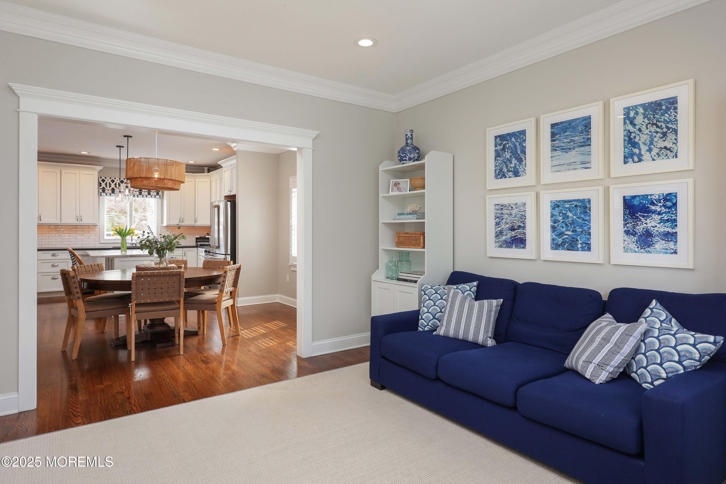 105 Black Point Road Rumson, NJ 07760 - Photo 10 of 27 a living room with furniture and a dining table with kitchen view