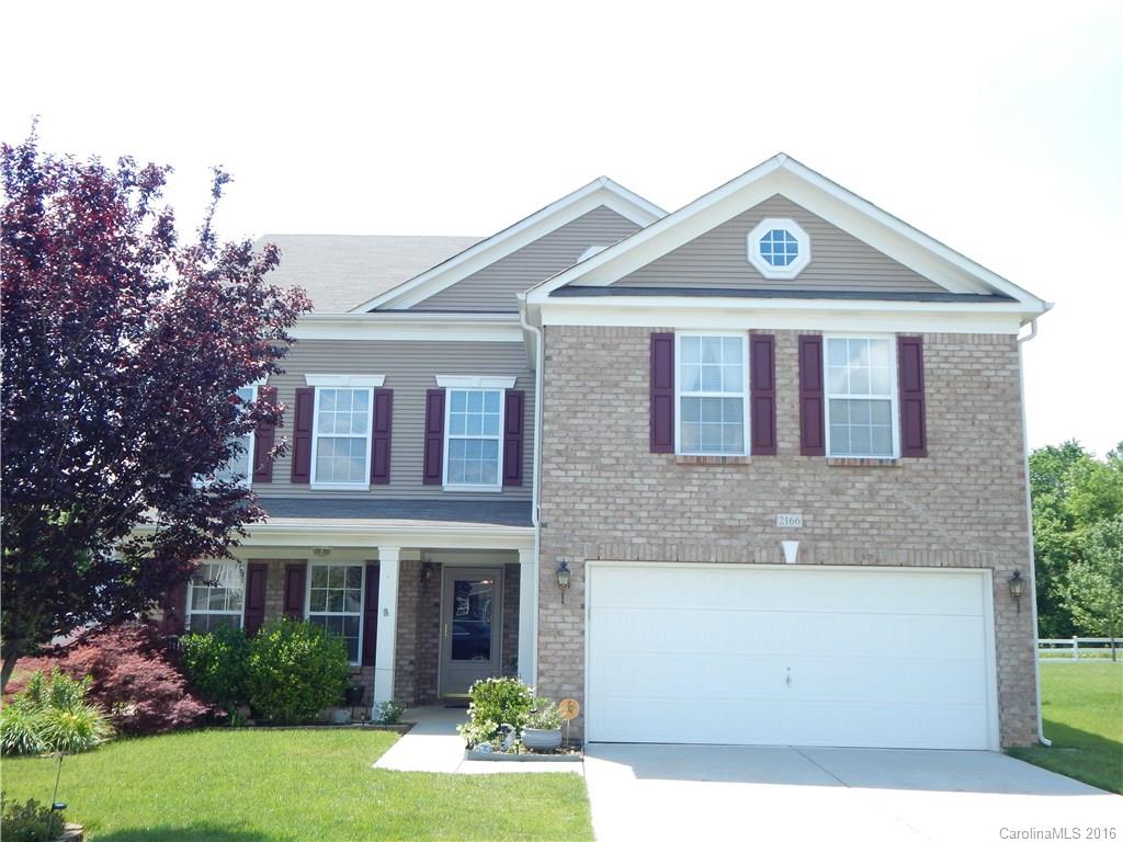 2166 Durand Road, Unit 39 Fort Mill, SC 29715 - Photo 1 of 23 a front view of a house with garden