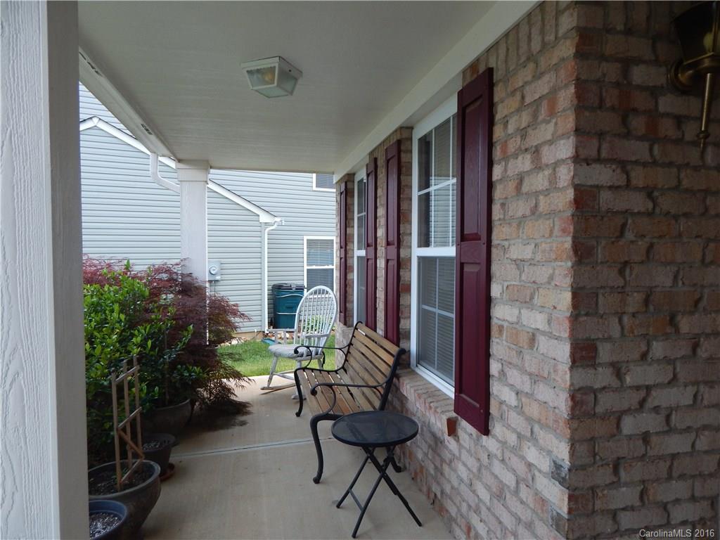 2166 Durand Road, Unit 39 Fort Mill, SC 29715 - Photo 2 of 23 a balcony with furniture and a potted plant