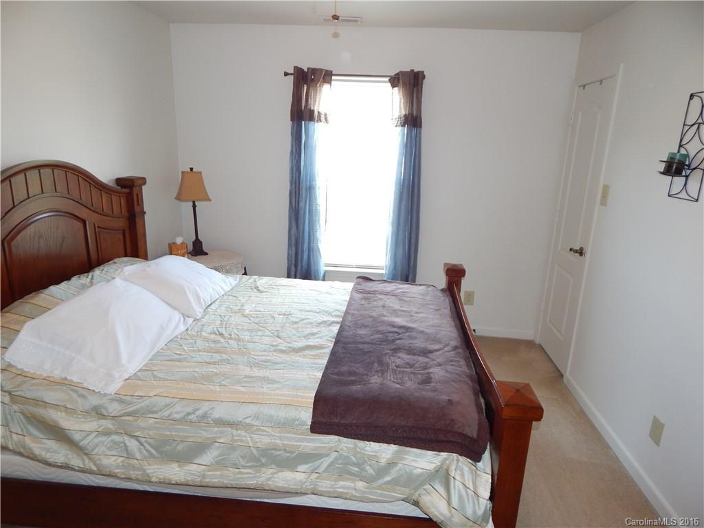 2166 Durand Road, Unit 39 Fort Mill, SC 29715 - Photo 12 of 23 a bed sitting in a bedroom next to a window