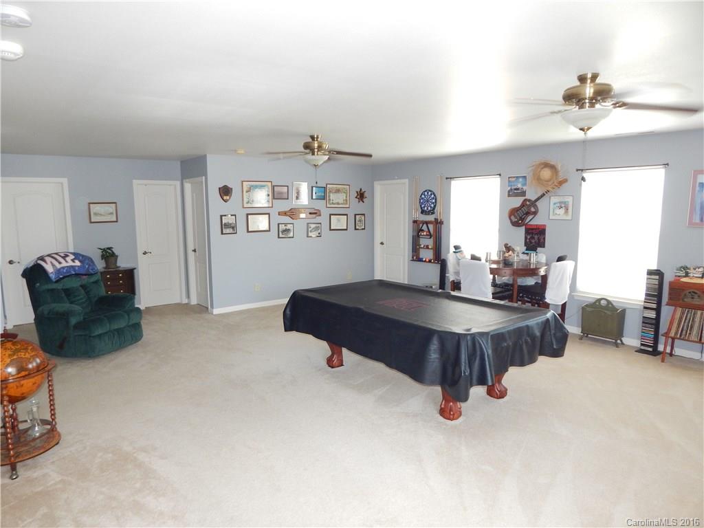 2166 Durand Road, Unit 39 Fort Mill, SC 29715 - Photo 13 of 23 a living room with furniture and chandelier