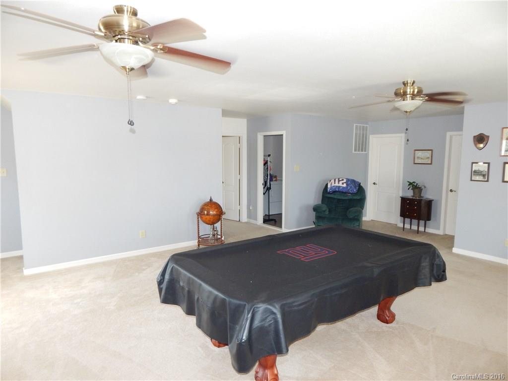 2166 Durand Road, Unit 39 Fort Mill, SC 29715 - Photo 14 of 23 a bedroom with a bed and a chandelier