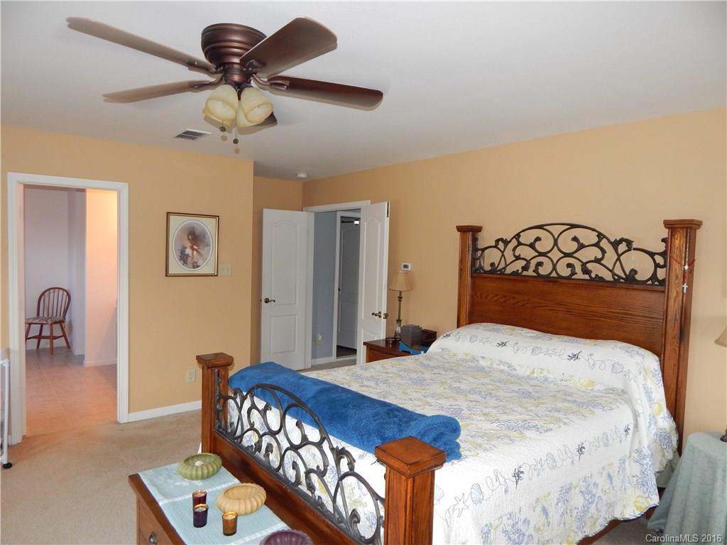 2166 Durand Road, Unit 39 Fort Mill, SC 29715 - Photo 15 of 23 a bedroom with a bed and a chandelier