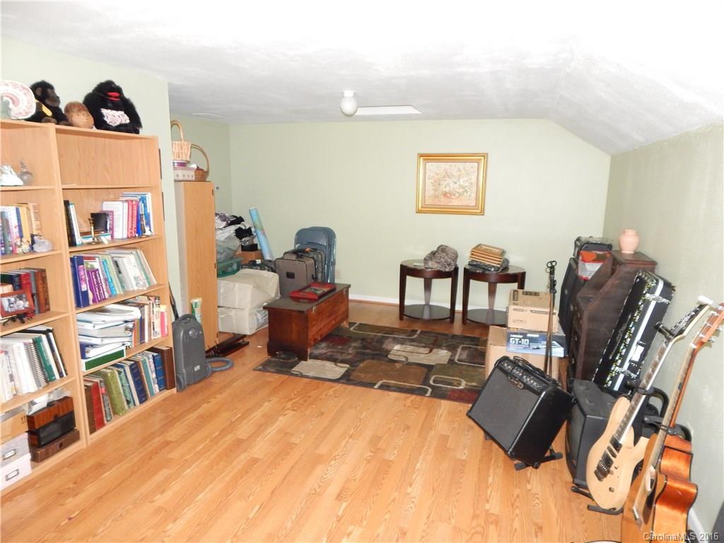 2166 Durand Road, Unit 39 Fort Mill, SC 29715 - Photo 20 of 23 a living room with furniture and a book shelf