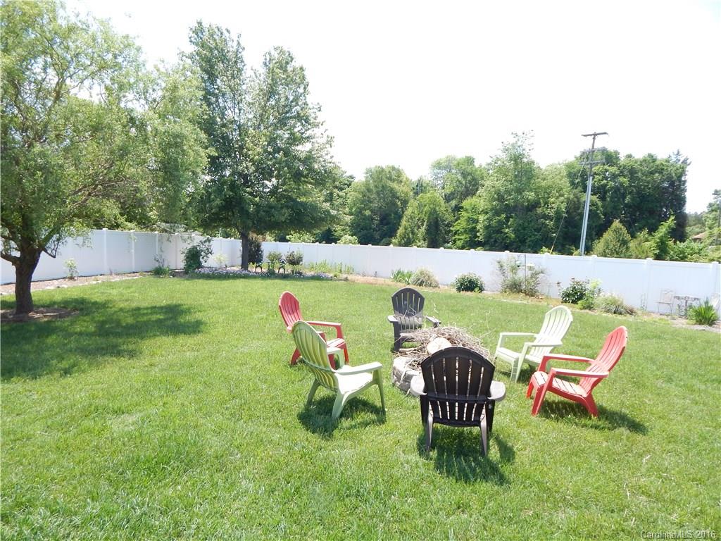 2166 Durand Road, Unit 39 Fort Mill, SC 29715 - Photo 23 of 23 a backyard of a house with table and chairs