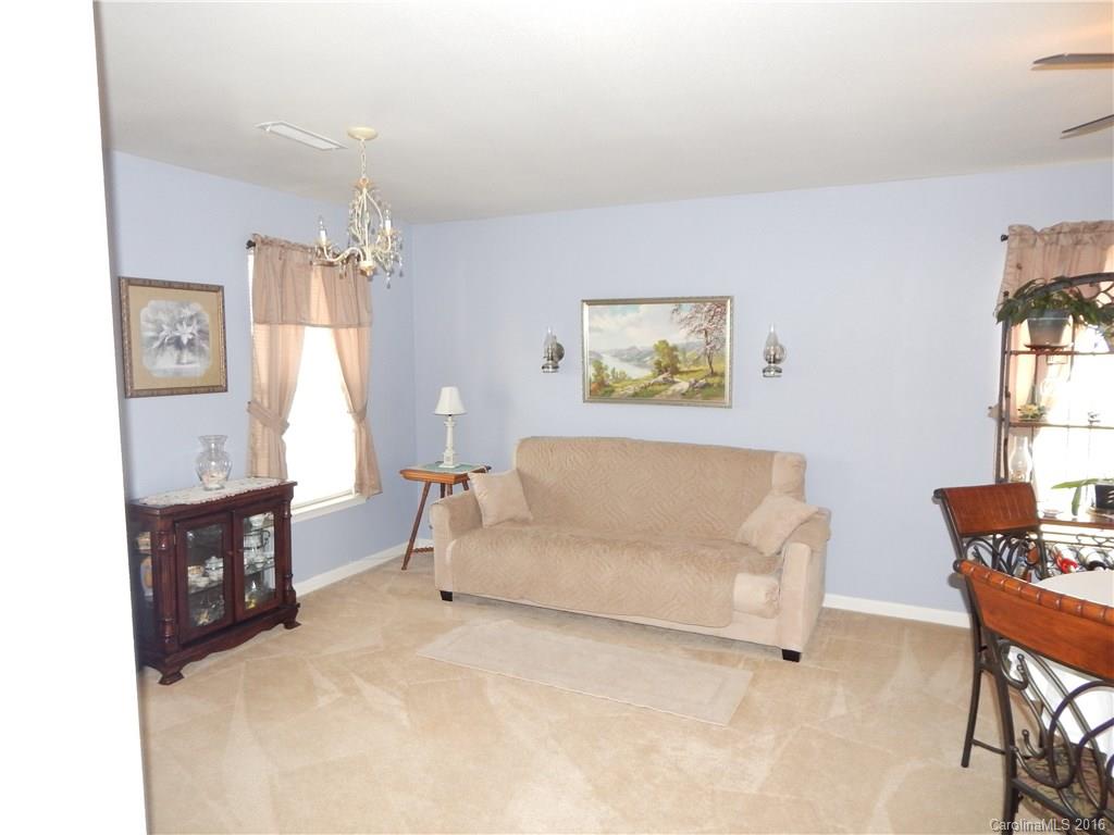2166 Durand Road, Unit 39 Fort Mill, SC 29715 - Photo 5 of 23 a living room with furniture and a dining table