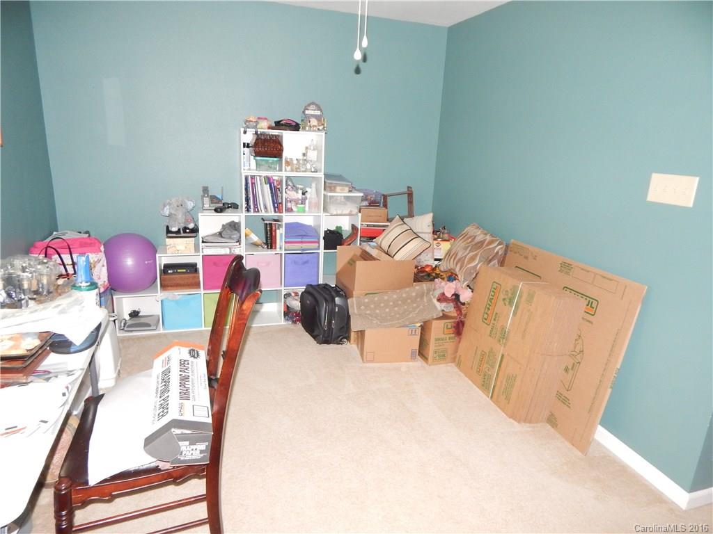 2166 Durand Road, Unit 39 Fort Mill, SC 29715 - Photo 7 of 23 a bed room with a bed and a couch