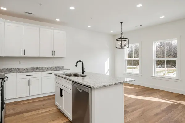 a view of room with window and wooden floor