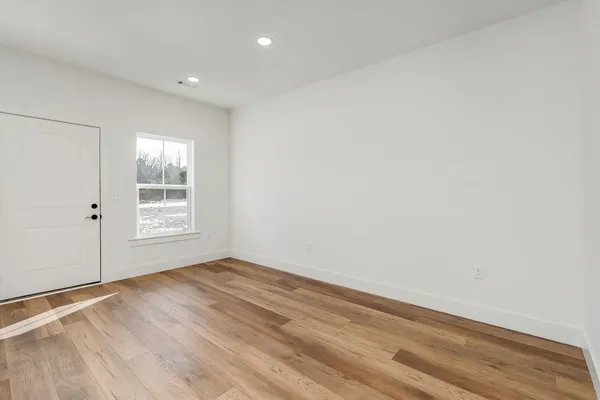 a view of a hallway with stairs