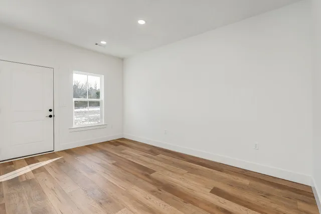 a view of a hallway with stairs