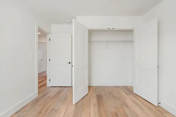 a bathroom with a granite countertop toilet a sink and a bathtub