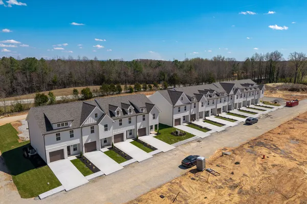 a view of roof deck with patio and mountain view