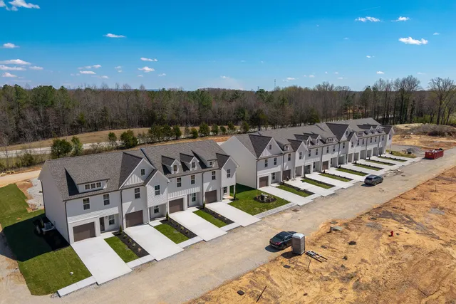 a view of roof deck with patio and mountain view
