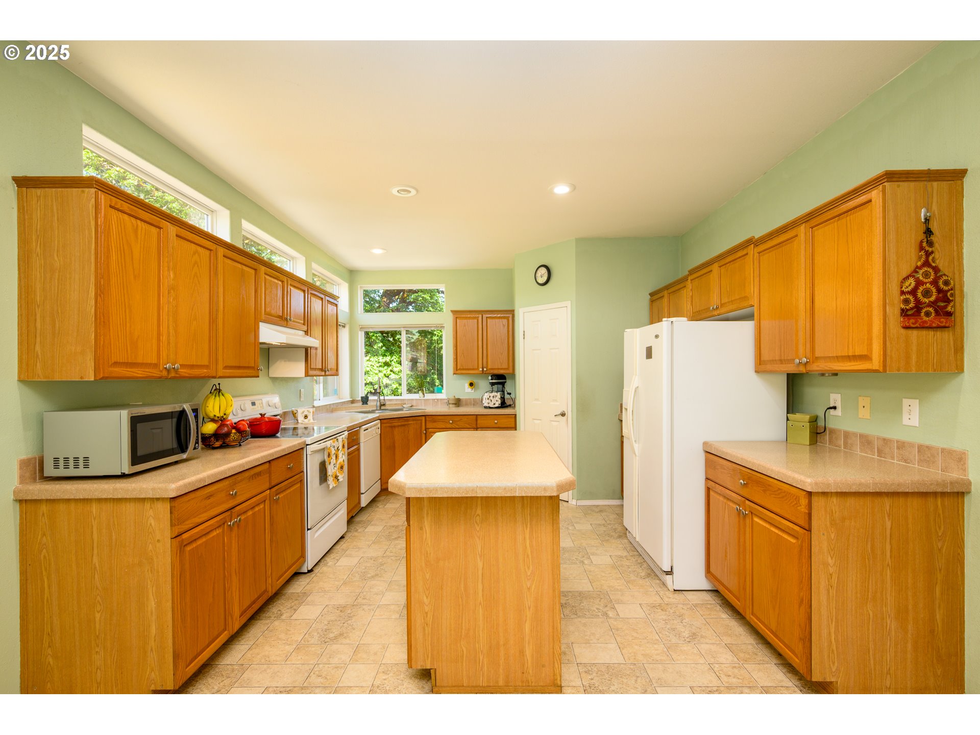 982 Reston Road Roseburg, OR 97471 - Photo 13 of 45 a kitchen with stainless steel appliances a sink a counter top space and cabinets
