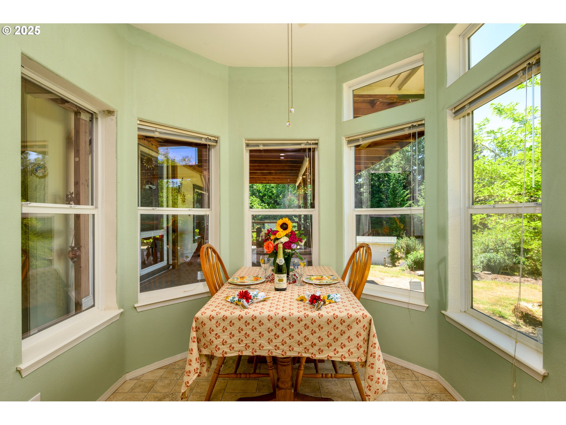 982 Reston Road Roseburg, OR 97471 - Photo 16 of 45 a bedroom with a bed and wooden floor