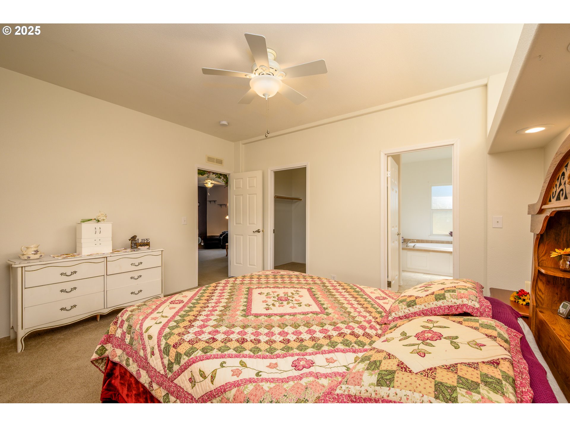 982 Reston Road Roseburg, OR 97471 - Photo 21 of 45 a bedroom with a bed and a chandelier