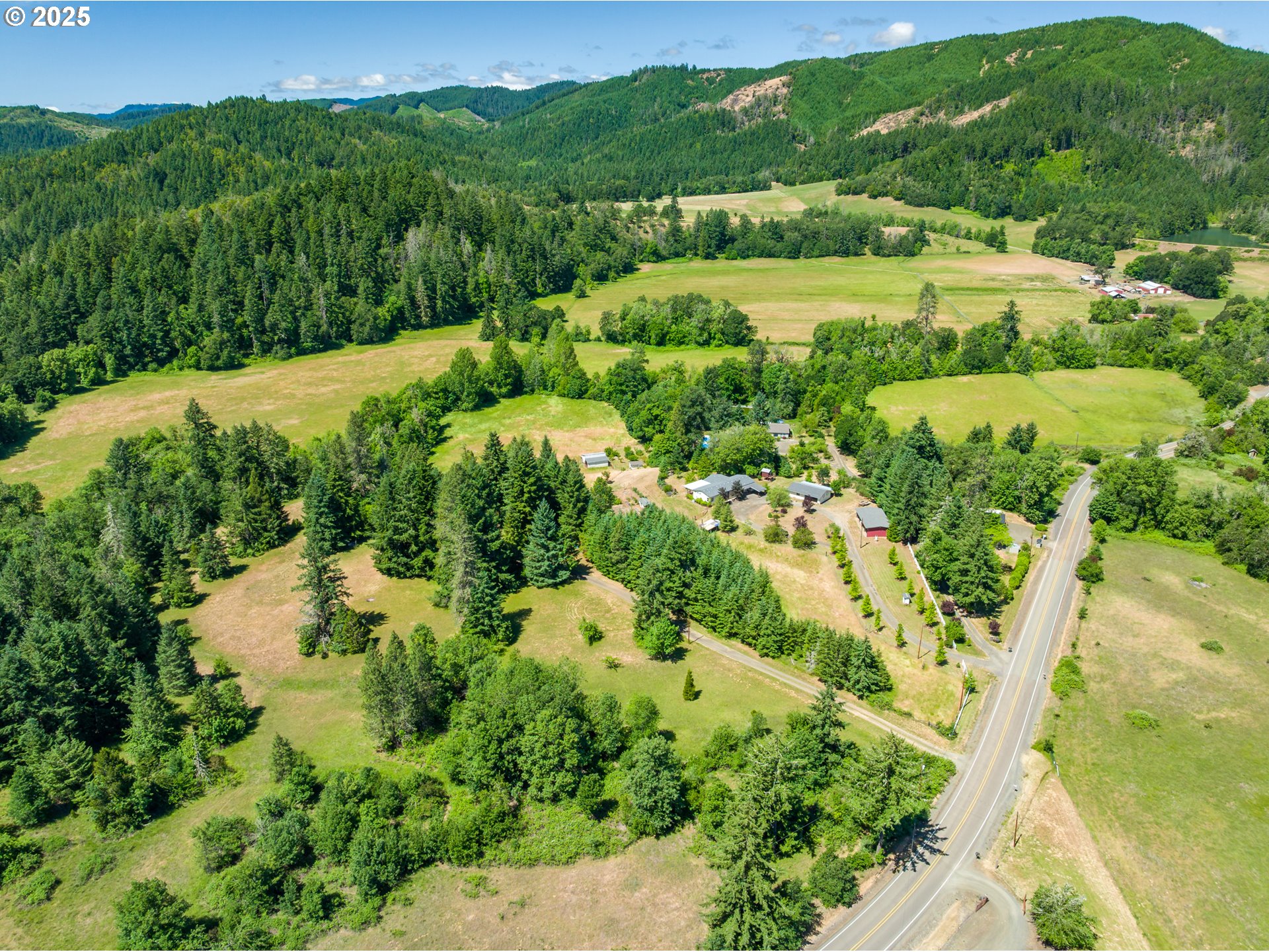982 Reston Road Roseburg, OR 97471 - Photo 34 of 45 an aerial view of residential houses with outdoor space and trees all around