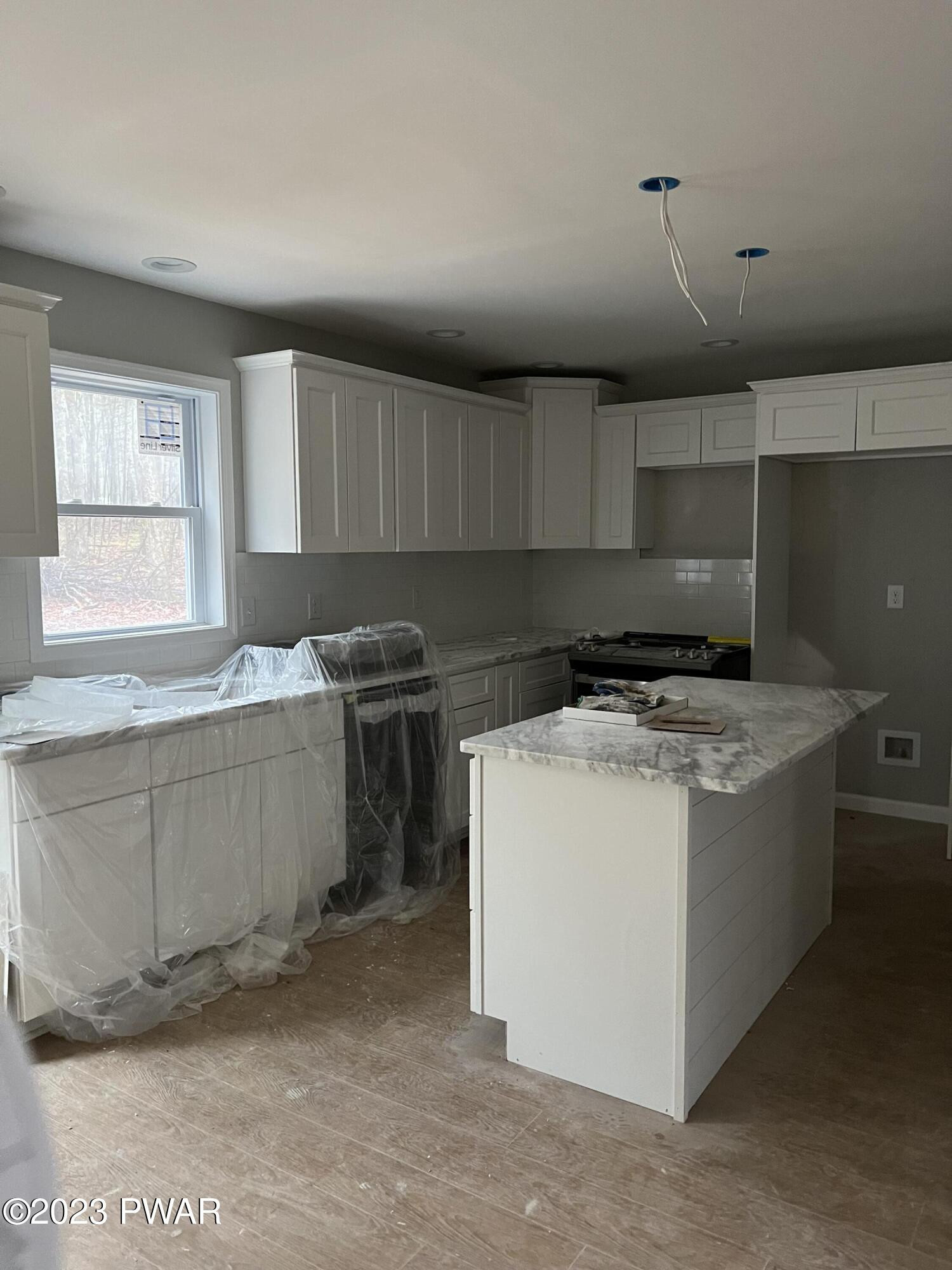 114 Rhododendron Lane Milford, PA 18337 - Photo 2 of 8 a kitchen with a stove and a sink