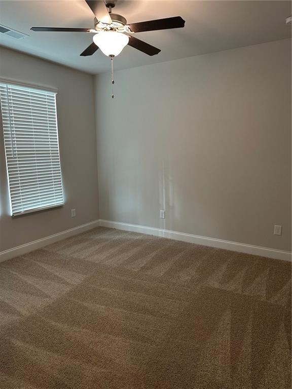 6162 Ripple Way, Unit 78 South Fulton, GA 30349 - Photo 12 of 19 a view of a room with a ceiling fan and a window