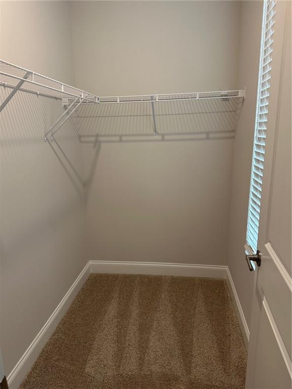 6162 Ripple Way, Unit 78 South Fulton, GA 30349 - Photo 13 of 19 a view of a room with racks on the wall