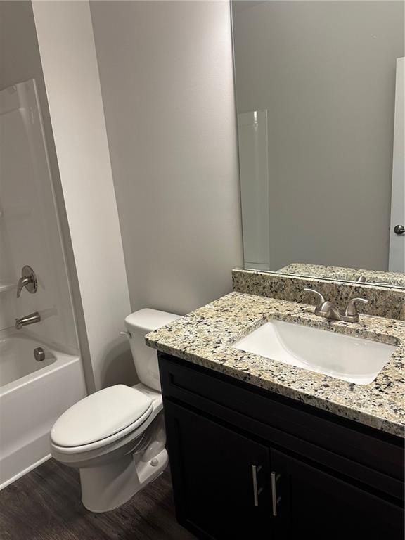6162 Ripple Way, Unit 78 South Fulton, GA 30349 - Photo 16 of 19 a bathroom with a granite countertop toilet sink and mirror
