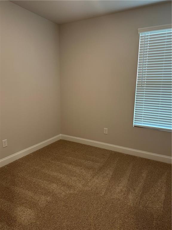 6162 Ripple Way, Unit 78 South Fulton, GA 30349 - Photo 17 of 19 a view of an empty room with a window