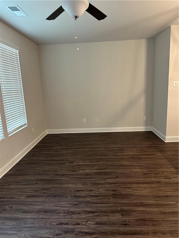 6162 Ripple Way, Unit 78 South Fulton, GA 30349 - Photo 3 of 19 an empty room with wooden floor and windows