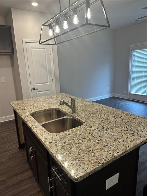 6162 Ripple Way, Unit 78 South Fulton, GA 30349 - Photo 6 of 19 a kitchen with granite countertop a sink and a refrigerator