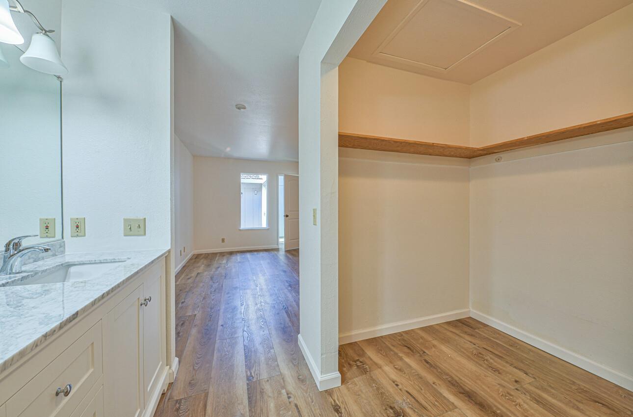 3850 Rio Road, Unit 51 Carmel, CA 93923 - Photo 12 of 24 a view of a kitchen cabinets a sink and wooden floor