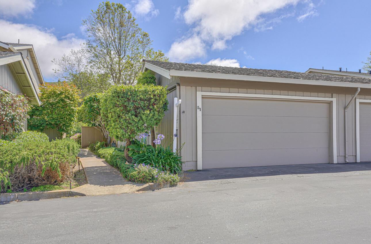 3850 Rio Road, Unit 51 Carmel, CA 93923 - Photo 21 of 24 front view of a house with a yard