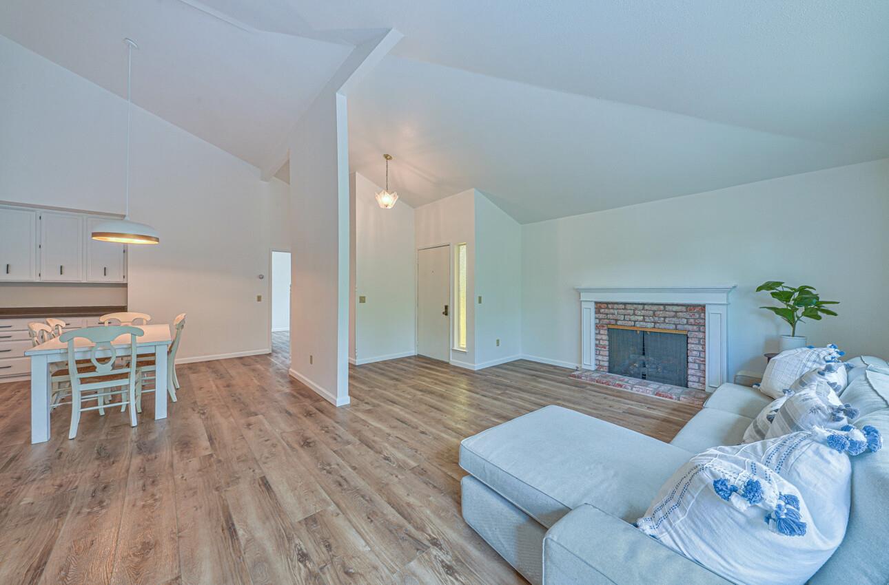 3850 Rio Road, Unit 51 Carmel, CA 93923 - Photo 3 of 24 a living room with furniture and a table