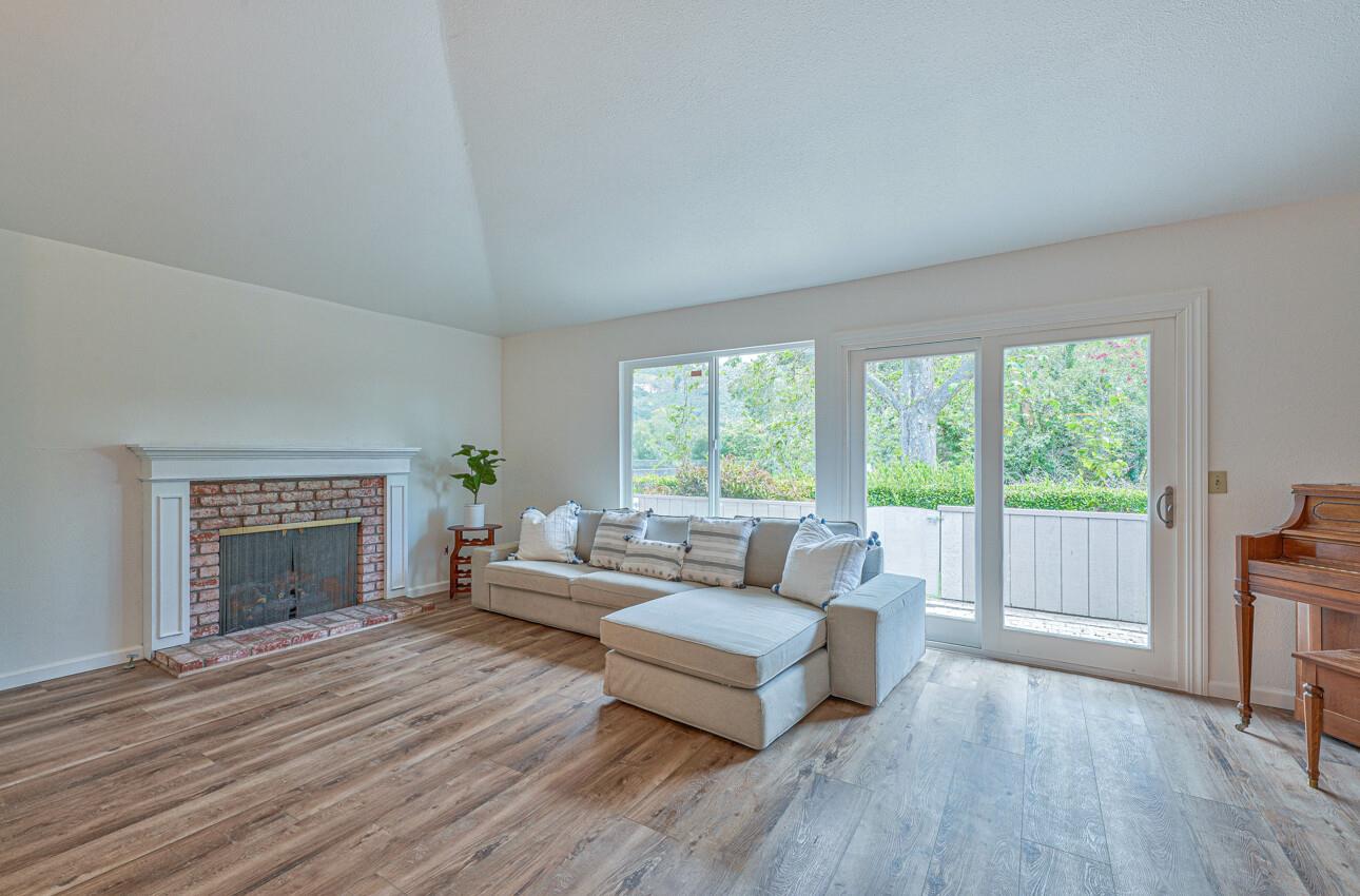 3850 Rio Road, Unit 51 Carmel, CA 93923 - Photo 4 of 24 a living room with furniture and a fireplace
