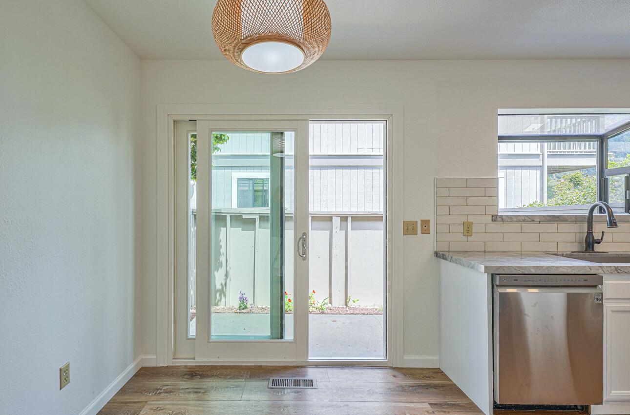 3850 Rio Road, Unit 51 Carmel, CA 93923 - Photo 7 of 24 a view of a kitchen cabinets and a wooden floor