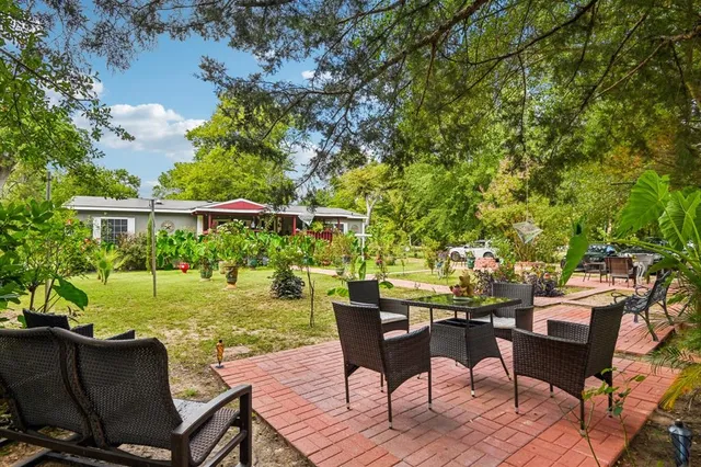 a view of a chairs and table in patio