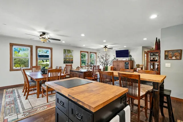 a kitchen with stainless steel appliances granite countertop a refrigerator and a sink