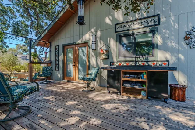 a view of balcony with furniture and wooden deck