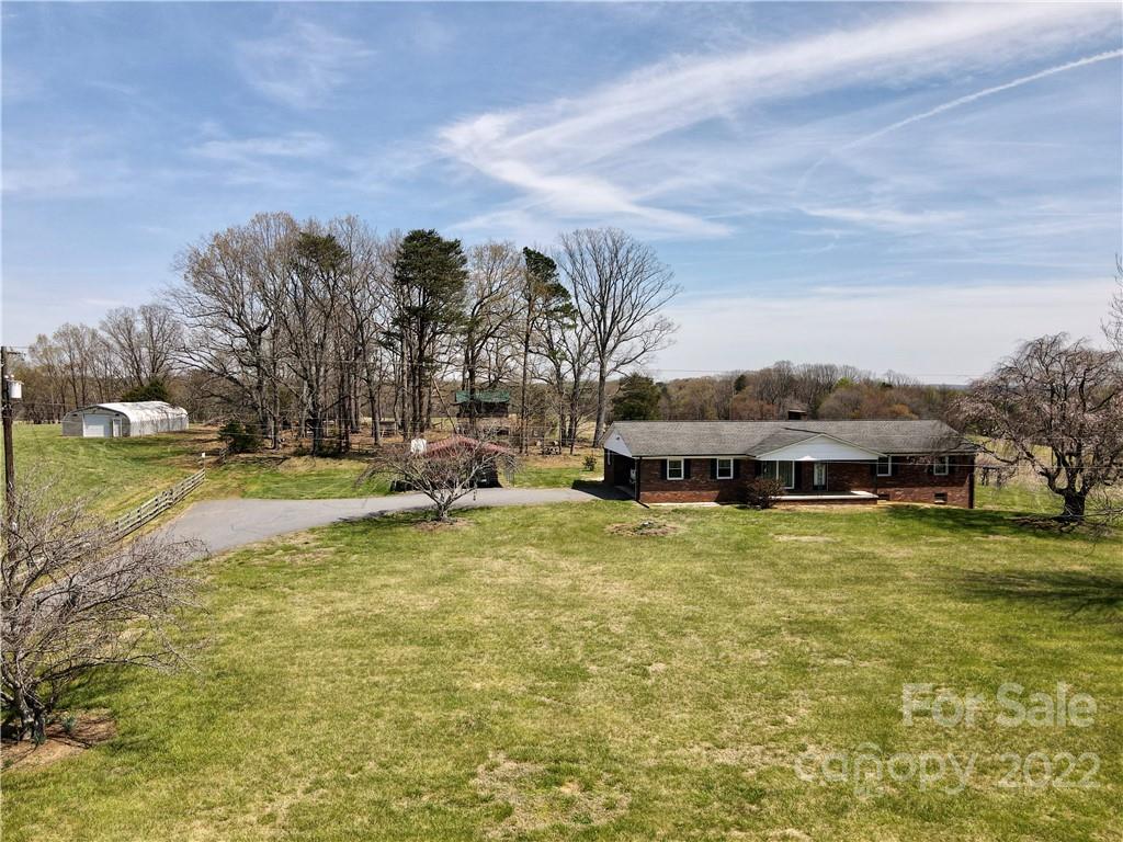 2122 Huckleberry Ridge Road Hiddenite, NC 28636 - Photo 2 of 40 a view of swimming pool is in front of residential houses