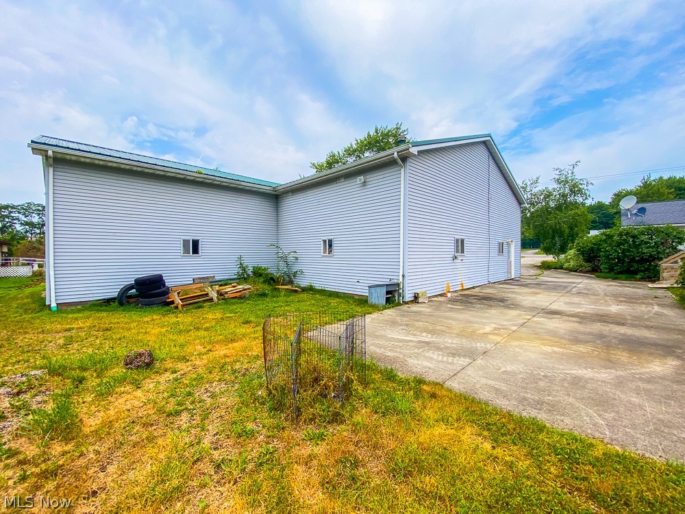 17499 Kinsman Road Middlefield, OH 44062 - Photo 43 of 49 View of home's exterior with a lawn