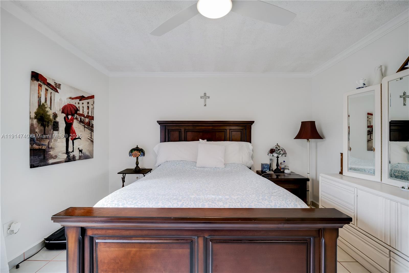 13249 Southwest 86th Lane Miami, FL 33183 - Photo 21 of 39 a bedroom with a bed and a table