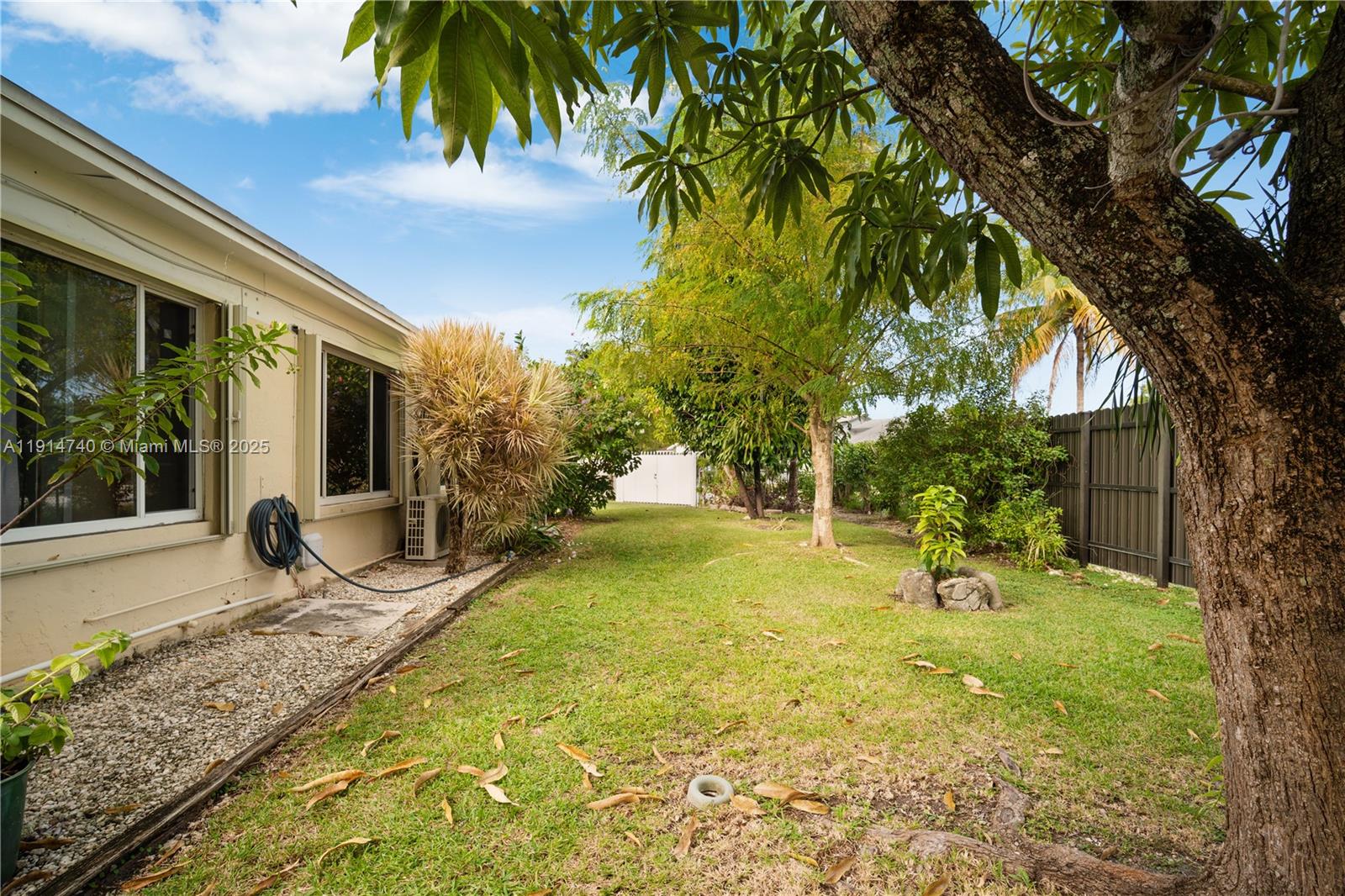 13249 Southwest 86th Lane Miami, FL 33183 - Photo 27 of 39 a view of a backyard with a garden