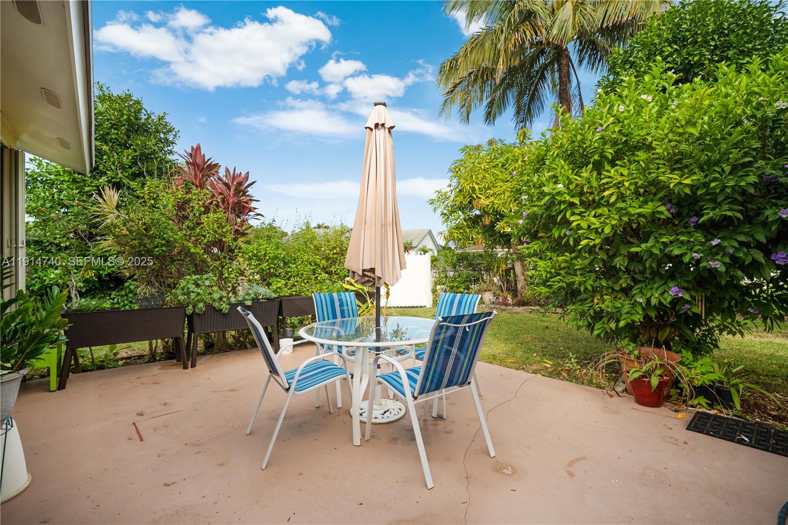 13249 Southwest 86th Lane Miami, FL 33183 - Photo 28 of 39 a view of a chairs and table in the patio
