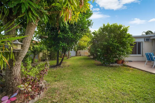 a view of a house with a back yard
