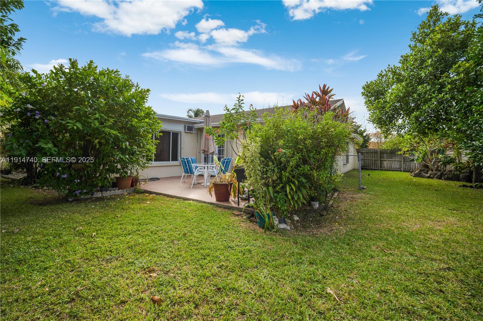 13249 Southwest 86th Lane Miami, FL 33183 - Photo 30 of 39 a view of a house with a back yard