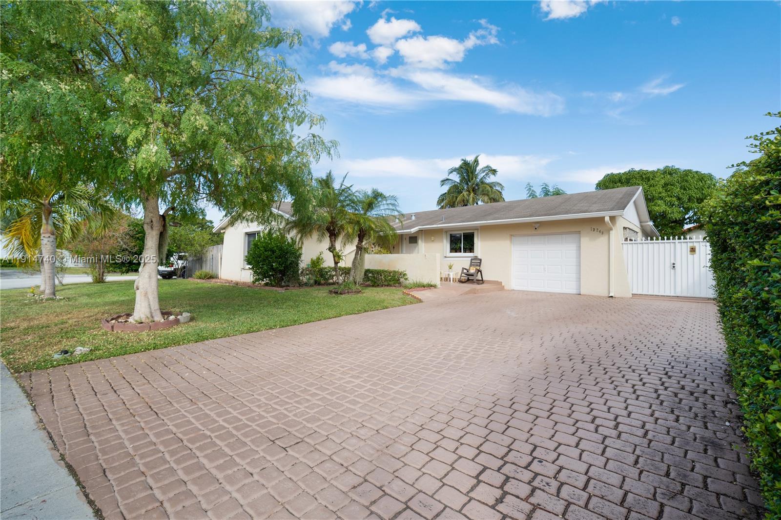13249 Southwest 86th Lane Miami, FL 33183 - Photo 3 of 39 a front view of house with yard and green space