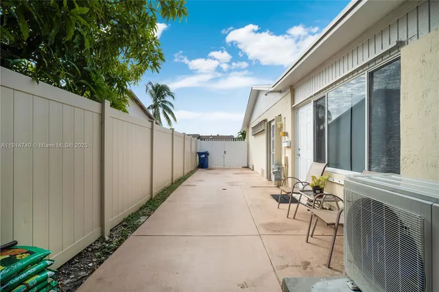 a view of a yard with palm trees