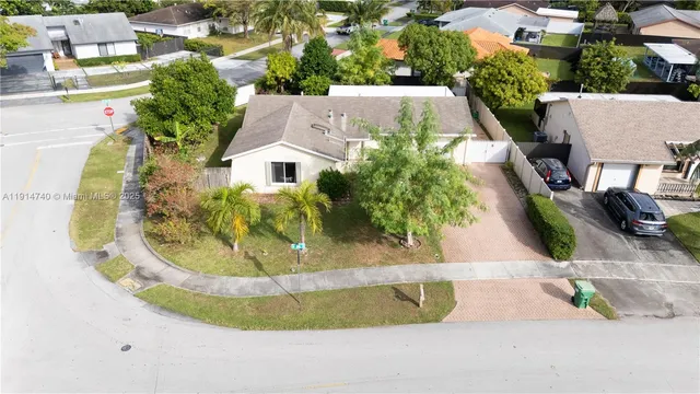 an aerial view of a house with swimming pool
